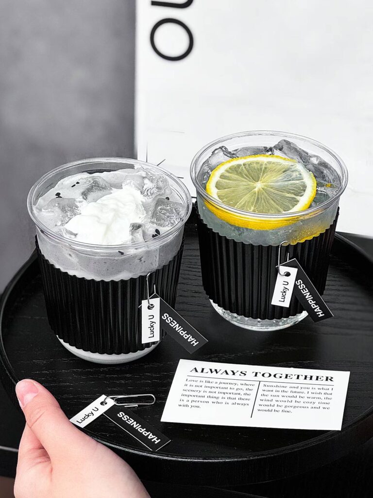 Clear Plastic Iced Coffee Cup with Black Corrugated Sleeve for Takeaway