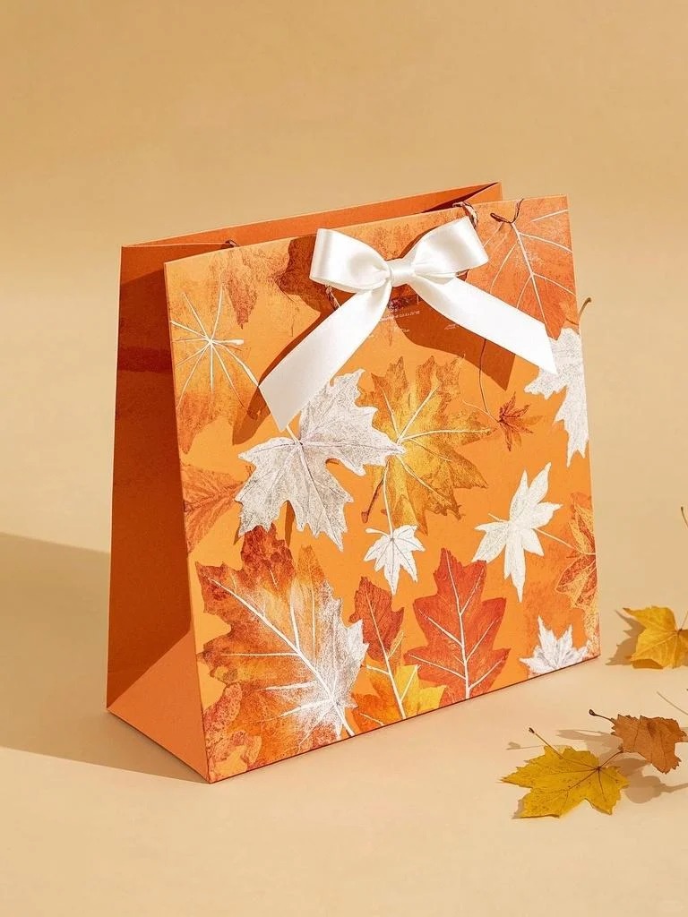 Autumn maple leaf print gift bag with satin bow